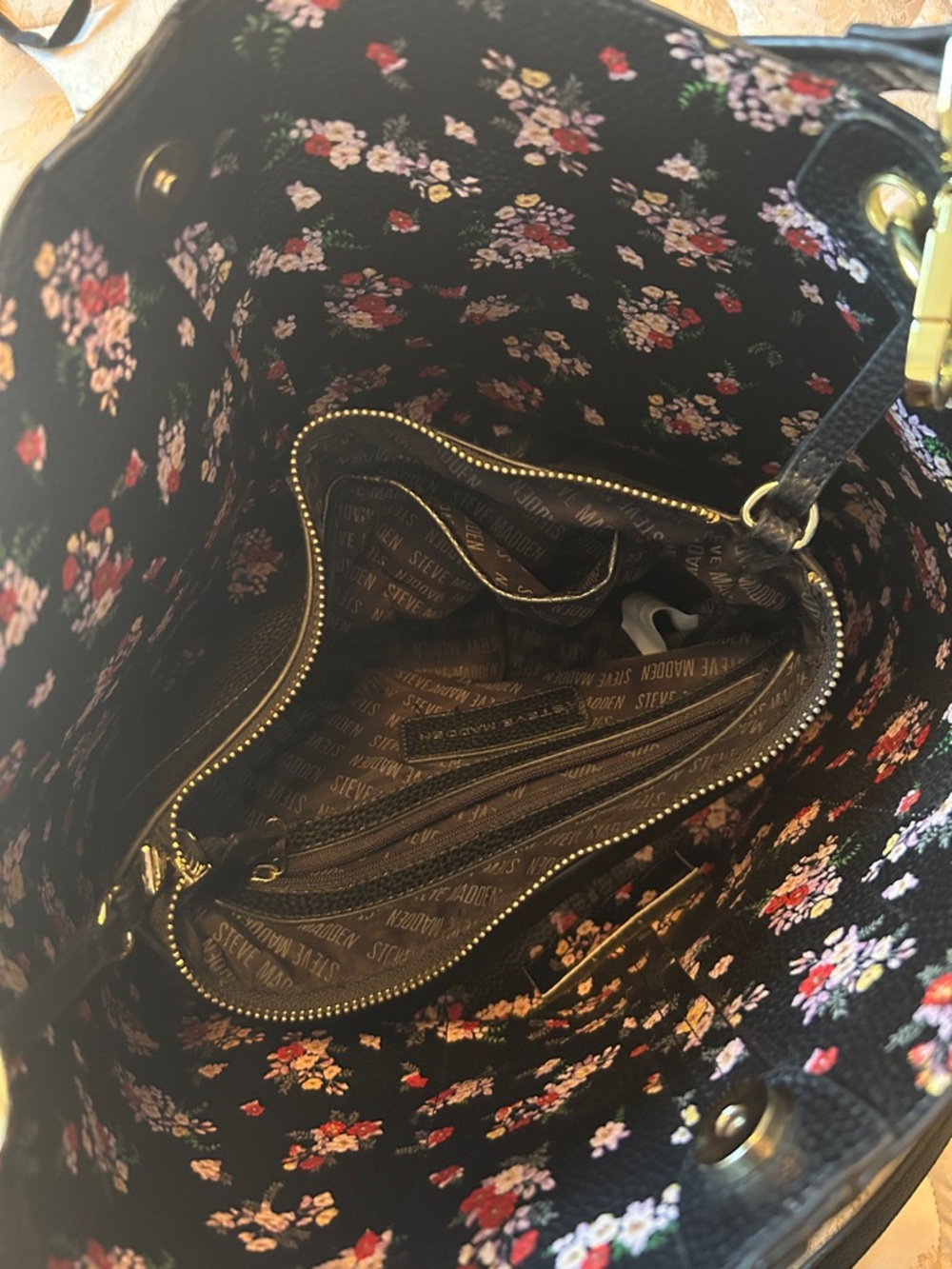Steve Madden bag, black with flower print, spacious, organizers in side